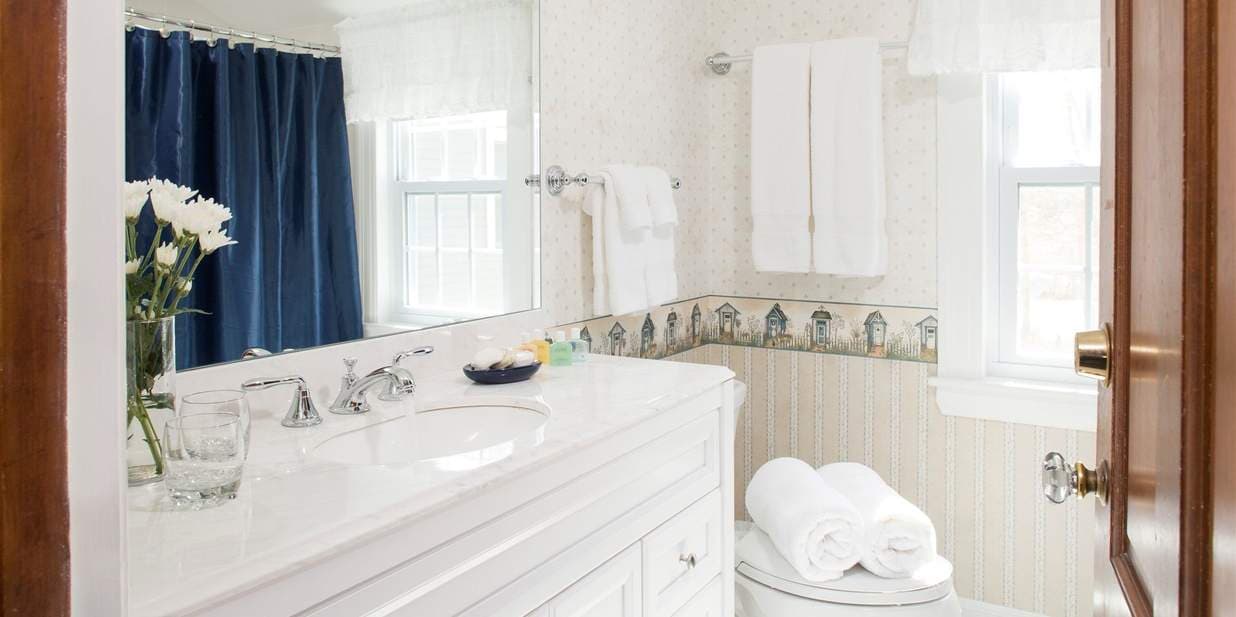 Bathroom for this room is located about six steps out of the room. It is not shared, just not directly in the room.