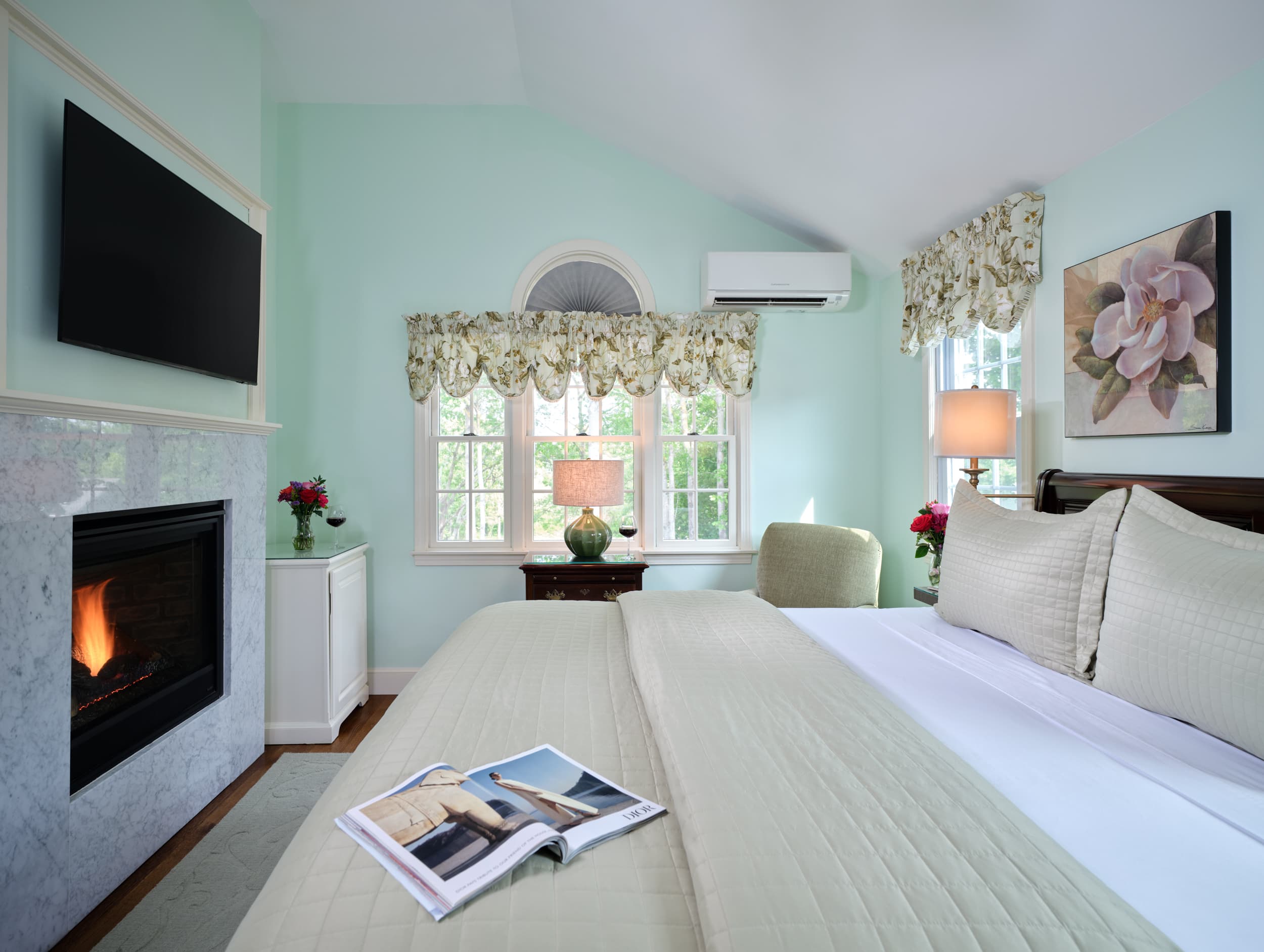 Two reading chairs, fireplace, flat screen TV, large windows, king bed