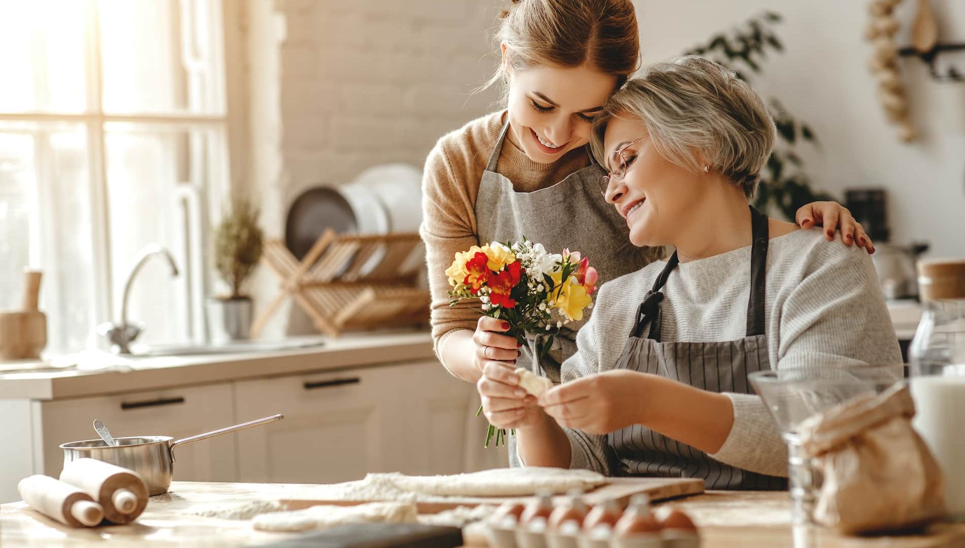 happy mother's day! family old grandmother mother-in-law and daughter-in-law daughter congratulate on the holiday, give flowers