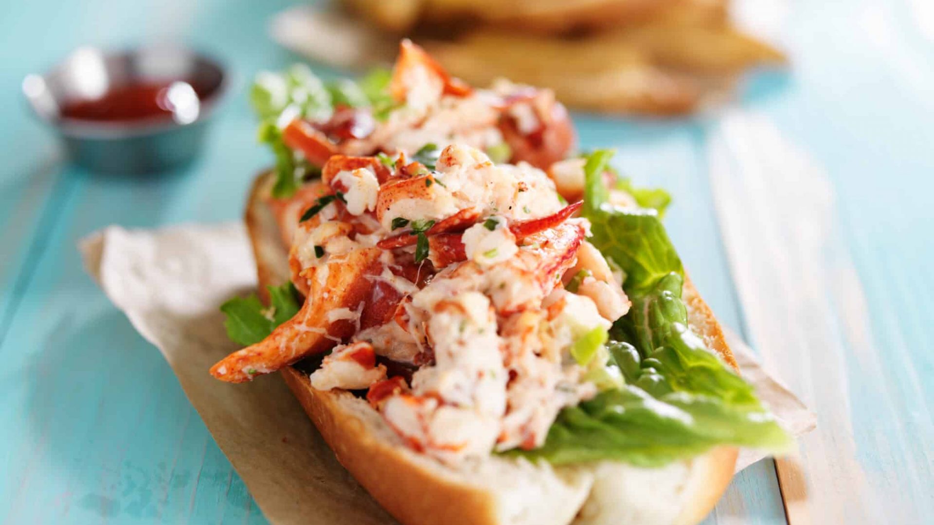 lobster roll on colorful retro painted wooden planks