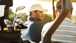 Father and son in a golf cart 