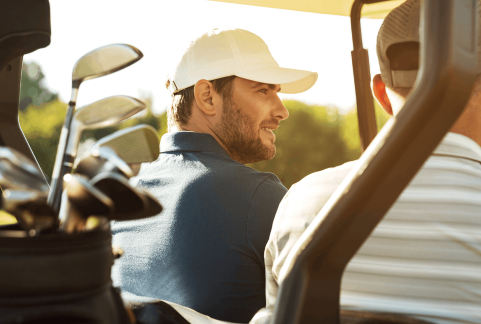 Father and son in a golf cart