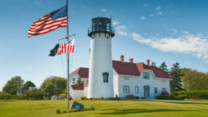 Chatham Lighthouse with the American Flag on a sunny day