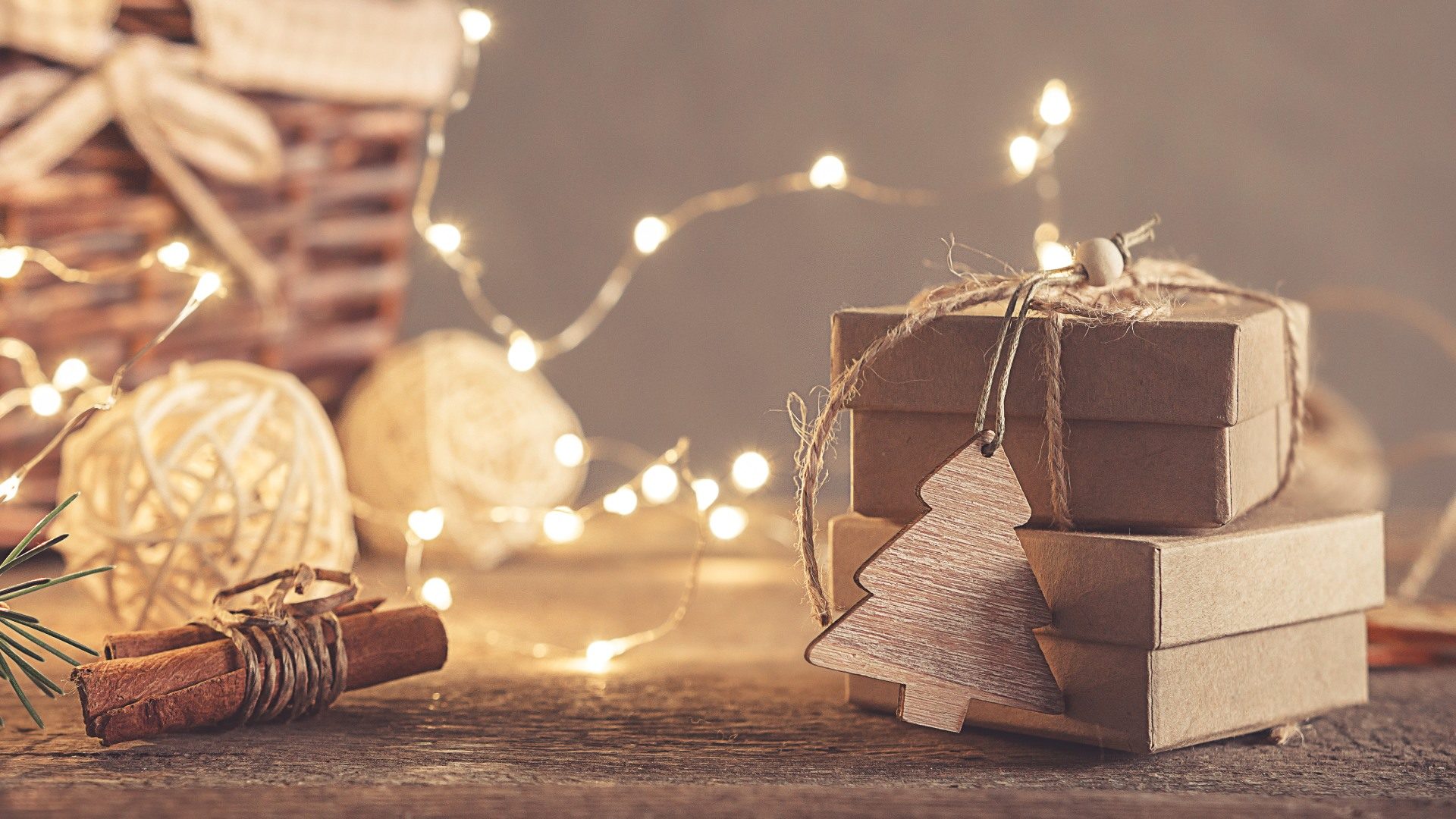 A small brown gift box wrapped for Christmas